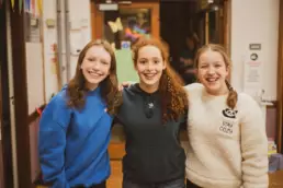 Young people smiling together during a Derryvolgie Youth group evening at Derryvolgie Church.