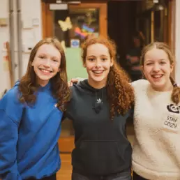 Young people smiling together during a Derryvolgie Youth group evening at Derryvolgie Church.