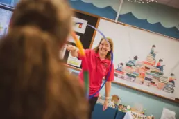 Child and play therapist using musical instruments as part of a play therapy session.