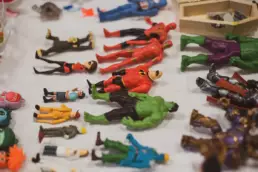 Therapeutic play figures and miniature objects used in play therapy sessions.