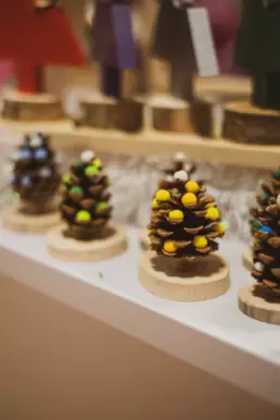 Close-up of handmade pinecone Christmas decorations crafted by a local stallholder